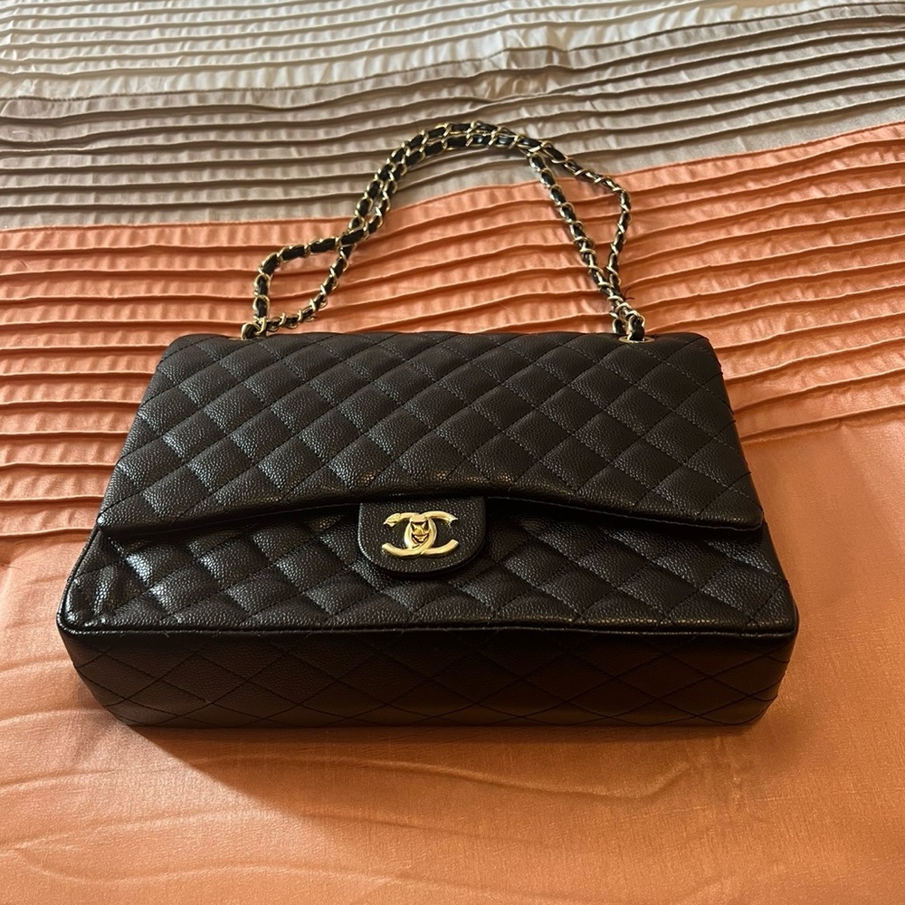 Chanel Caviar Quilted Maxi Double Flap Black purse.  100% Authentic